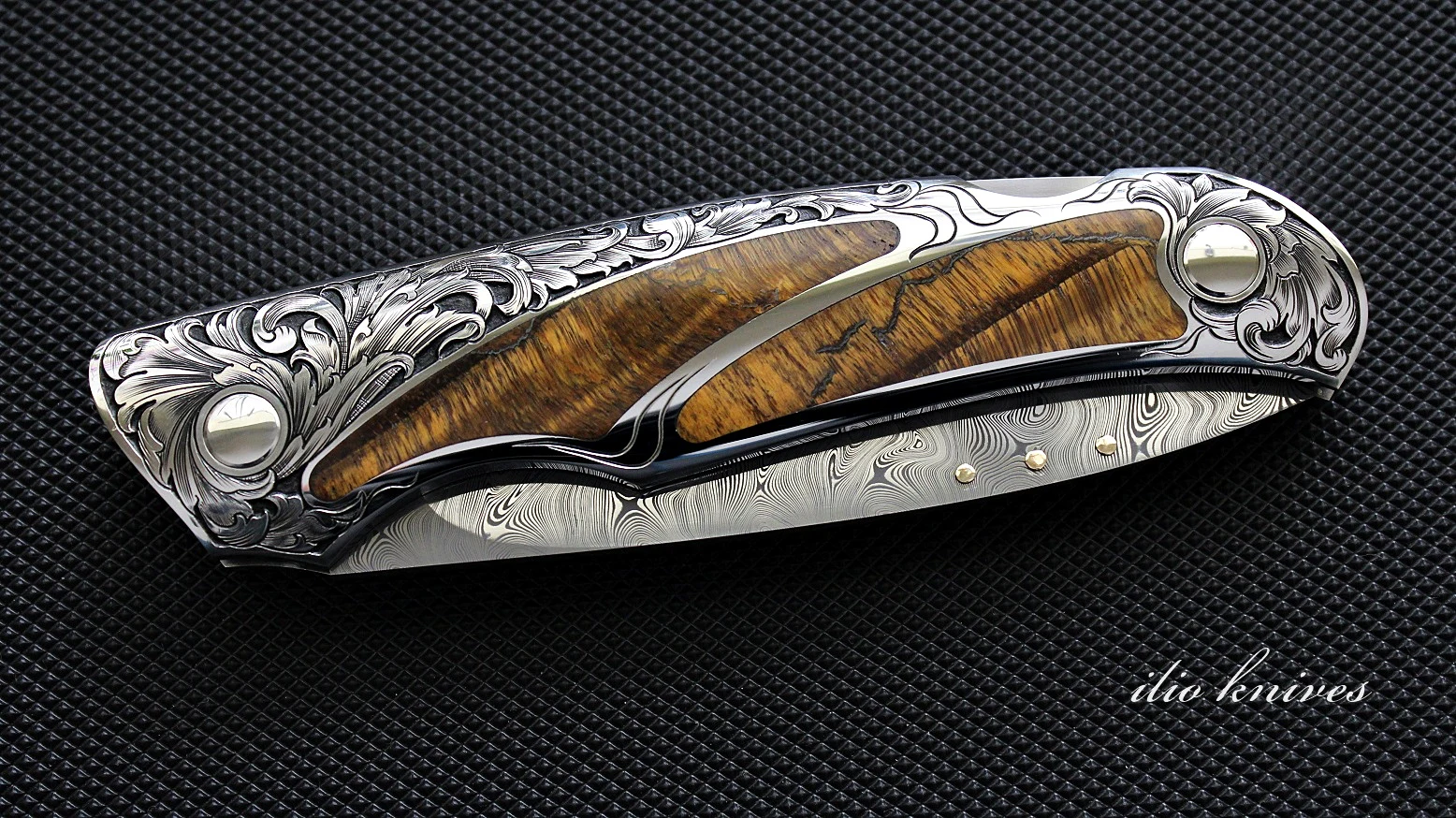 Reverse side of the closed tiger-eye folding knife
