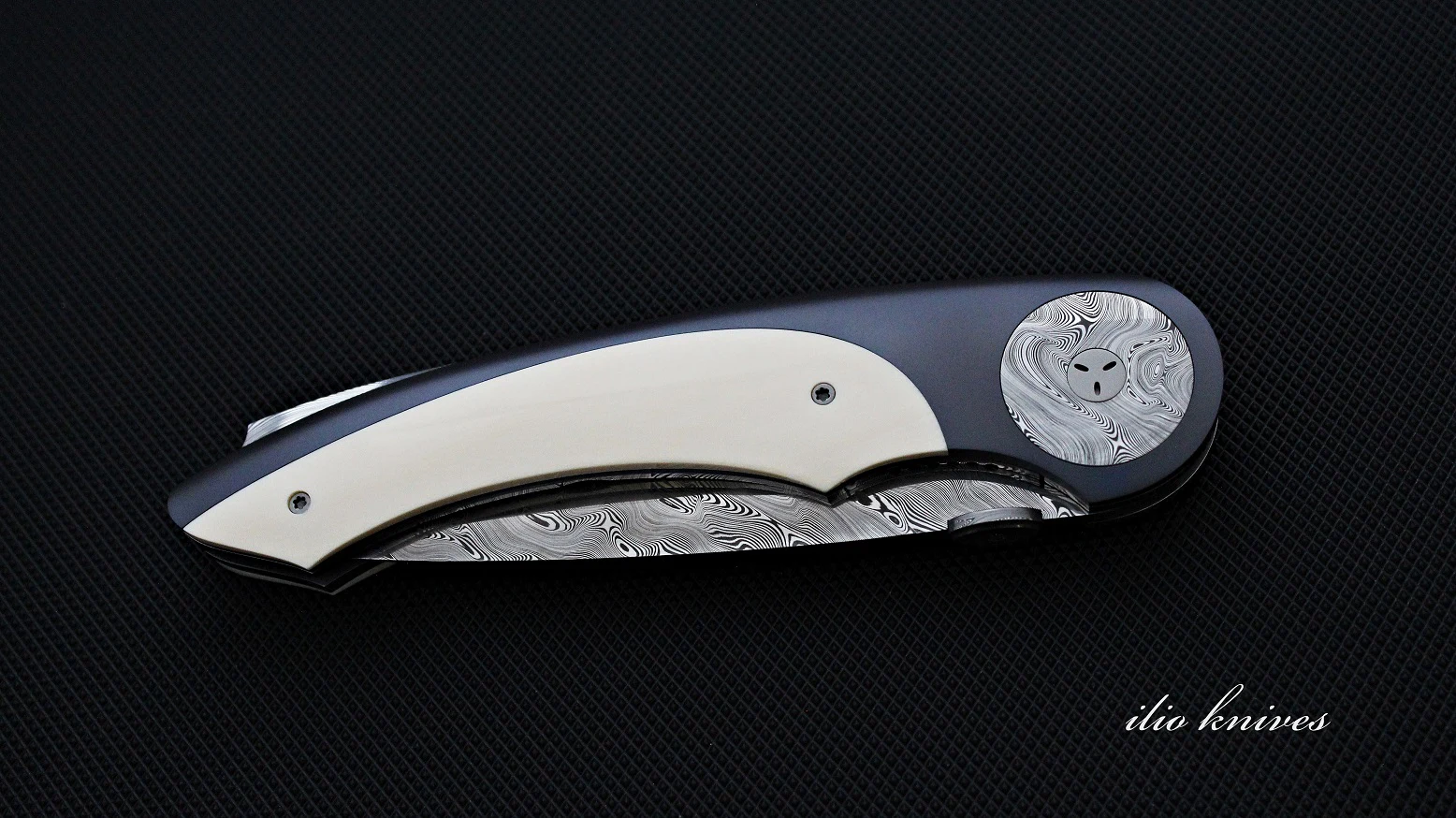 Reverse side of the closed Titanium and Damasteel liner-lock knife